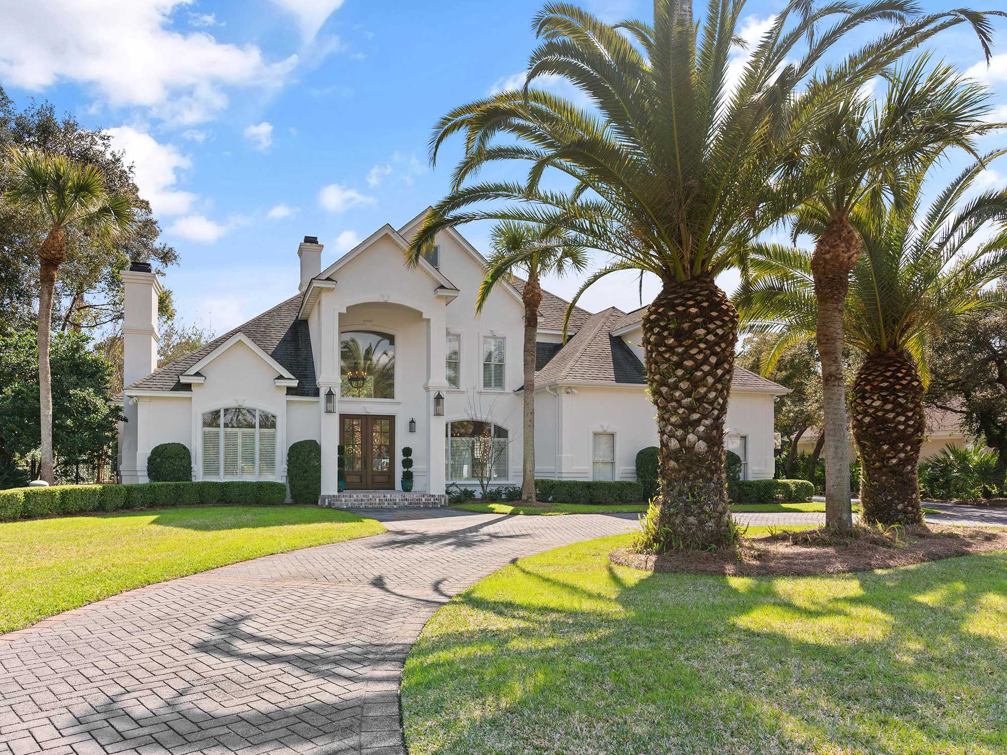 House With palm trees in the front